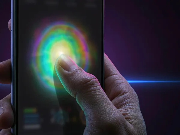 98s + Finger touching a glowing circle on a phone screen